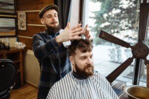 barber-in-hat-and-bearded-customer-barbershop-RHYXVCD